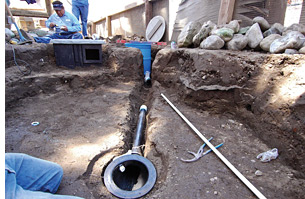 Installation of the drain into the bottom of a pond